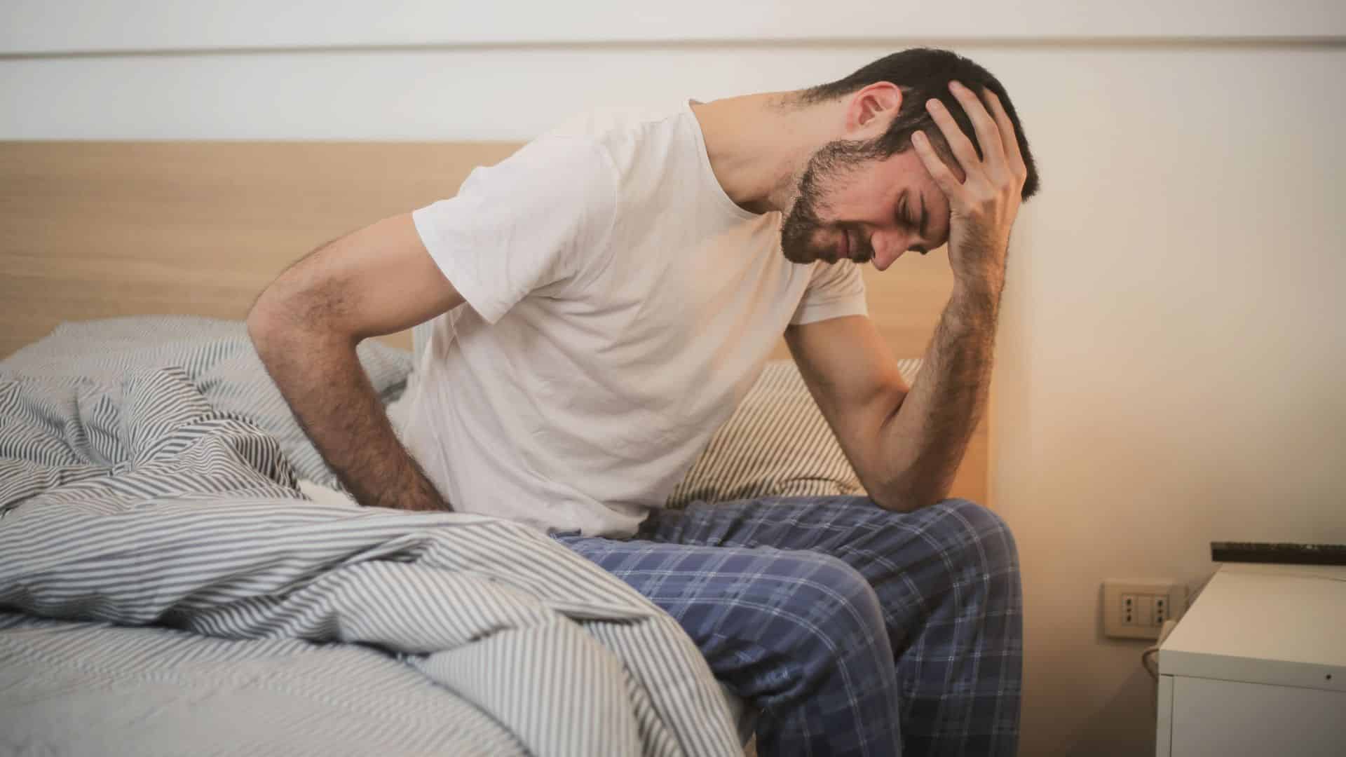 Young Man Holding His Head In Pain