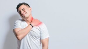 Man Touching His Neck Due To Pain