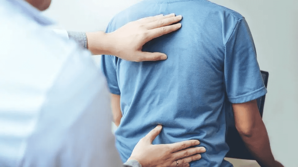 A Doctor Treating Patient at Pain Management Clinic in Dyer, IN