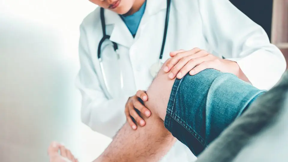 A Doctor Treating A Patient's Knee in La Porte, IN